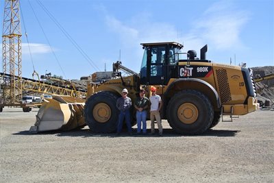 Bing crew in front of CAT equipment